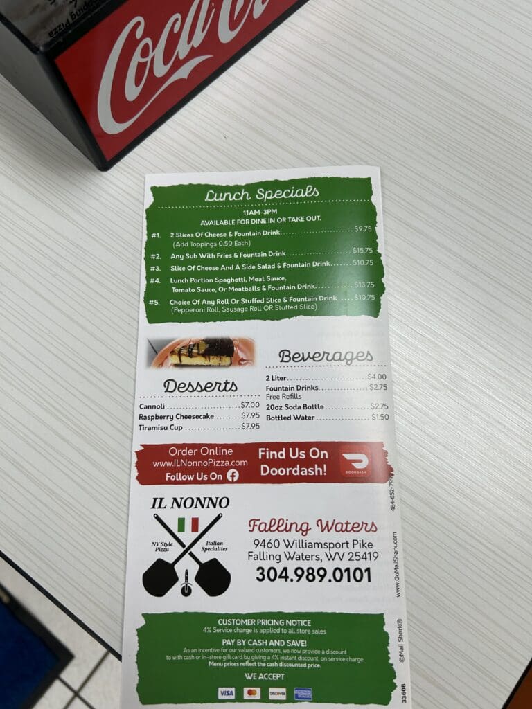 A collection of printed event program materials and information cards laid out flat, featuring green and red branding with contact information and event details visible.