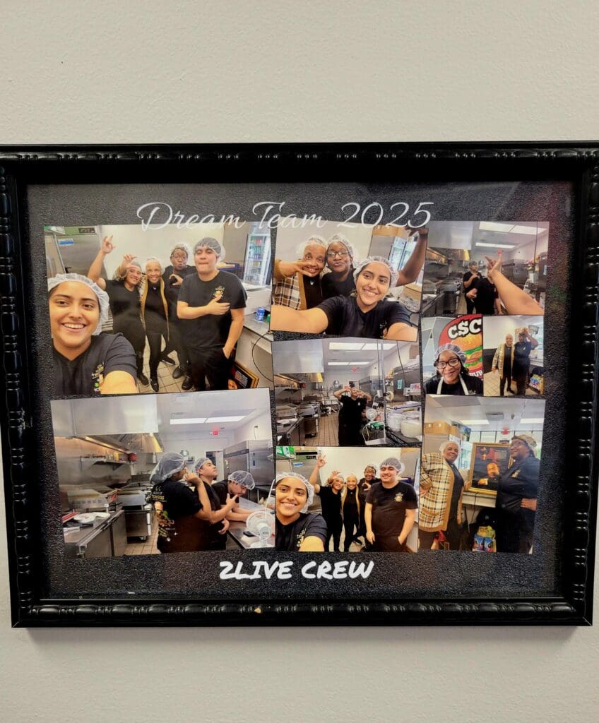 A framed collage of multiple photographs showing a group crew at what appears to be an indoor event or venue, with various candid moments and group shots arranged in a grid layout.