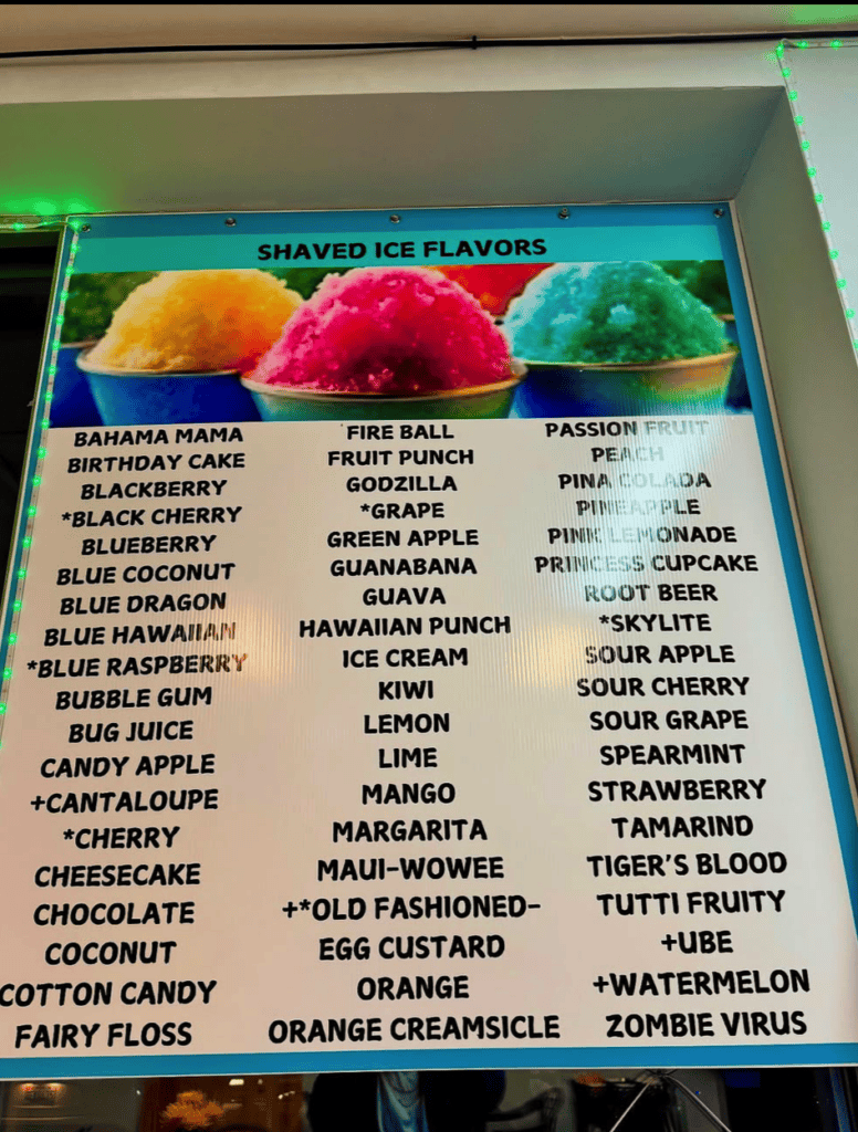 A colorful shaved ice flavor menu board displaying three large ice cups in yellow, pink, and green with an extensive list of available flavor options.