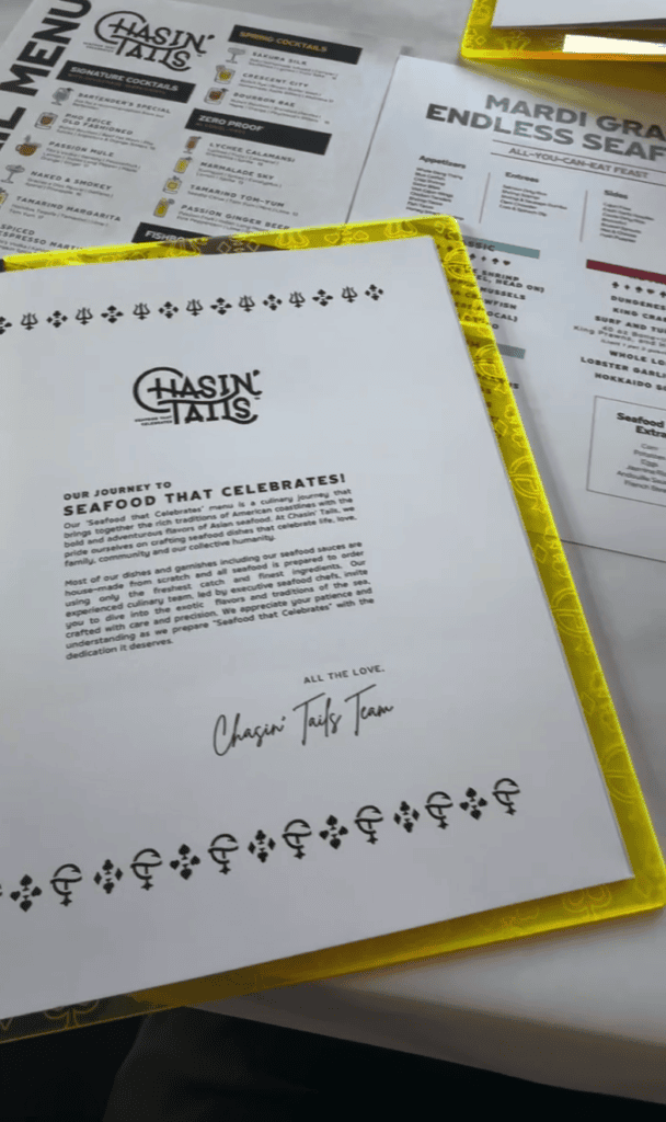 An overhead view of official documents and certificates with yellow highlighting and decorative borders scattered on a workspace.