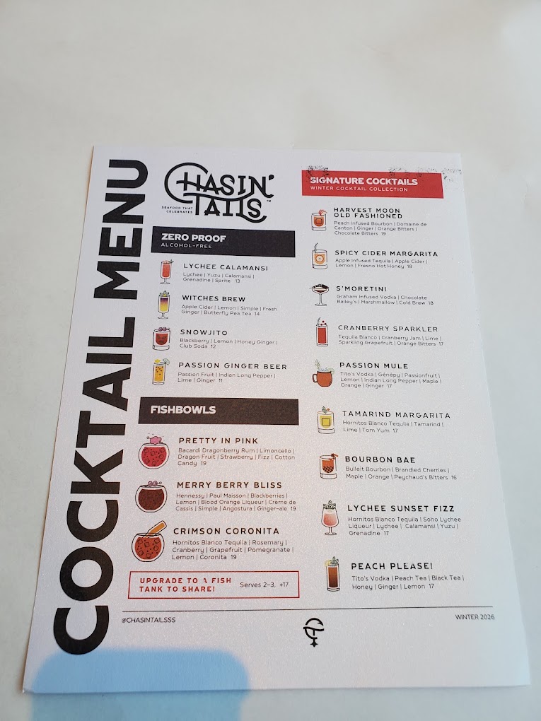 A printed cocktail menu displaying various basic cocktail recipes and instructions with a white background and red accent headers.