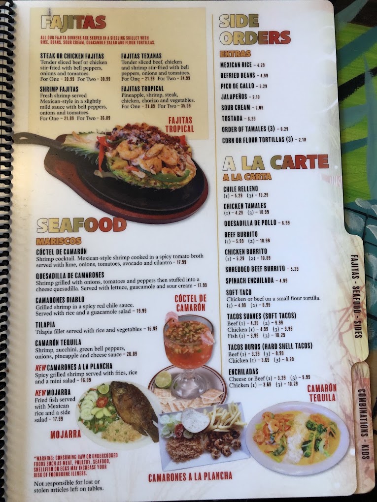 A spiral-bound restaurant menu page featuring colorful food photography of tacos, seafood dishes, and appetizers with Spanish text and pricing information.
