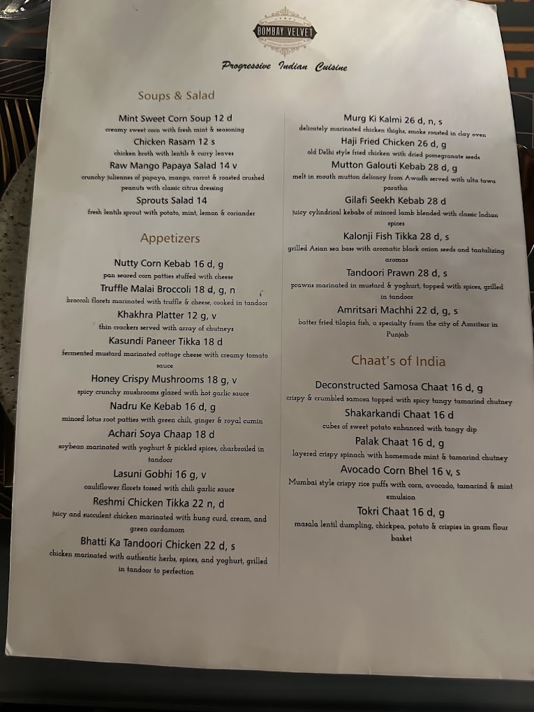 A restaurant or bar menu printed on white paper listing various food and beverage items with descriptions and prices.